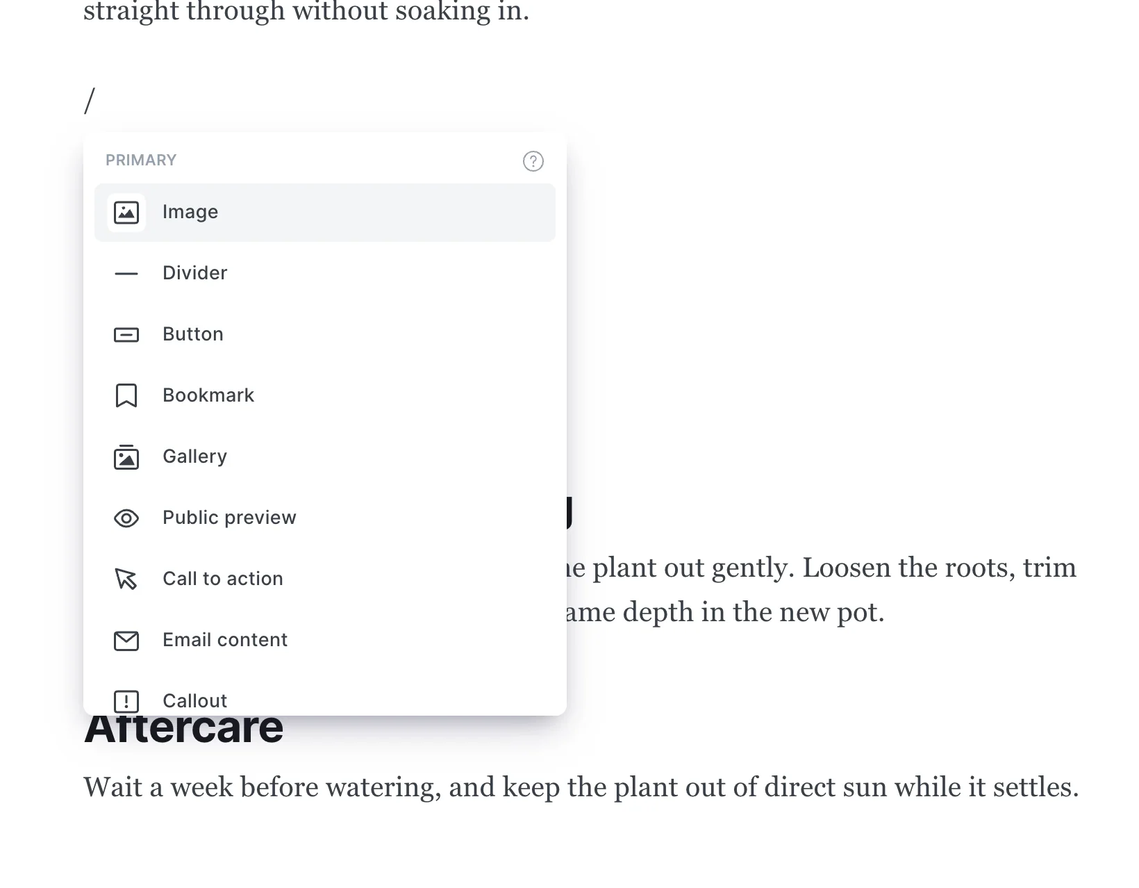 Typing a forward slash in the Ghost editor opens the card menu with Image, Gallery, Divider, Bookmark, Callout, Toggle and other cards